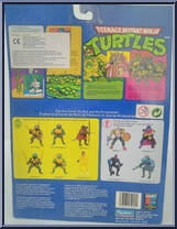 April O' Neil (Orange & Blue Stripe) [Reissue] from Teenage Mutant Ninja Turtles - 1998 - Basic Figures manufactured by Playmates [Back]
